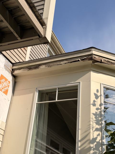 Bay window trim with rot being repaired
