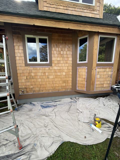 Window trim on a cedar shingle wall