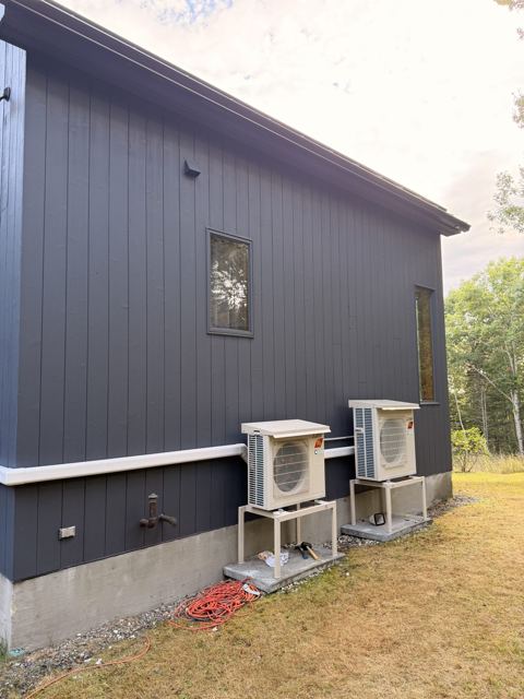 Modern house exterior painted charcoal gray